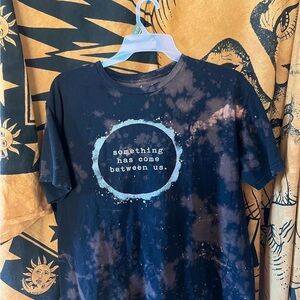 Bleached Black Graphic Tee "something has come between us."